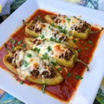 banana pepper recipe with beef rice filling melted cheese and tomato sauce