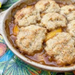 Best Ever Peach Cobbler baked with juicy peaches and golden topping.