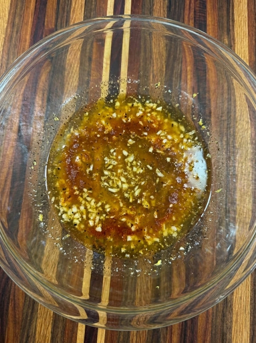 Garlic butter coating mixed with paprika and lemon zest
