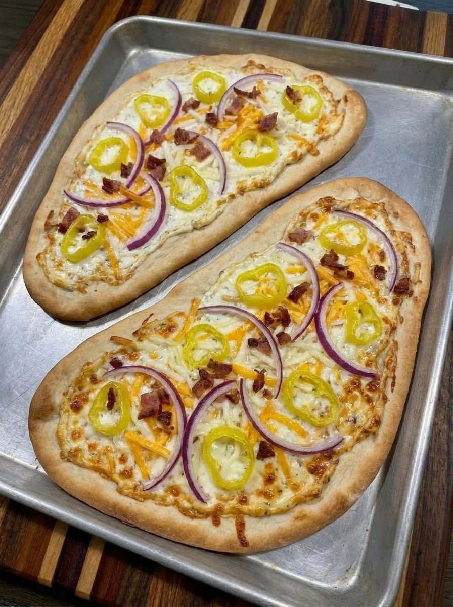 Baked Loaded Banana Pepper Flatbread with melted cheese