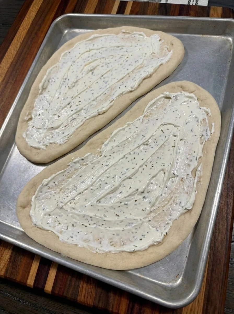 Creamy cheese base spread on flatbread
