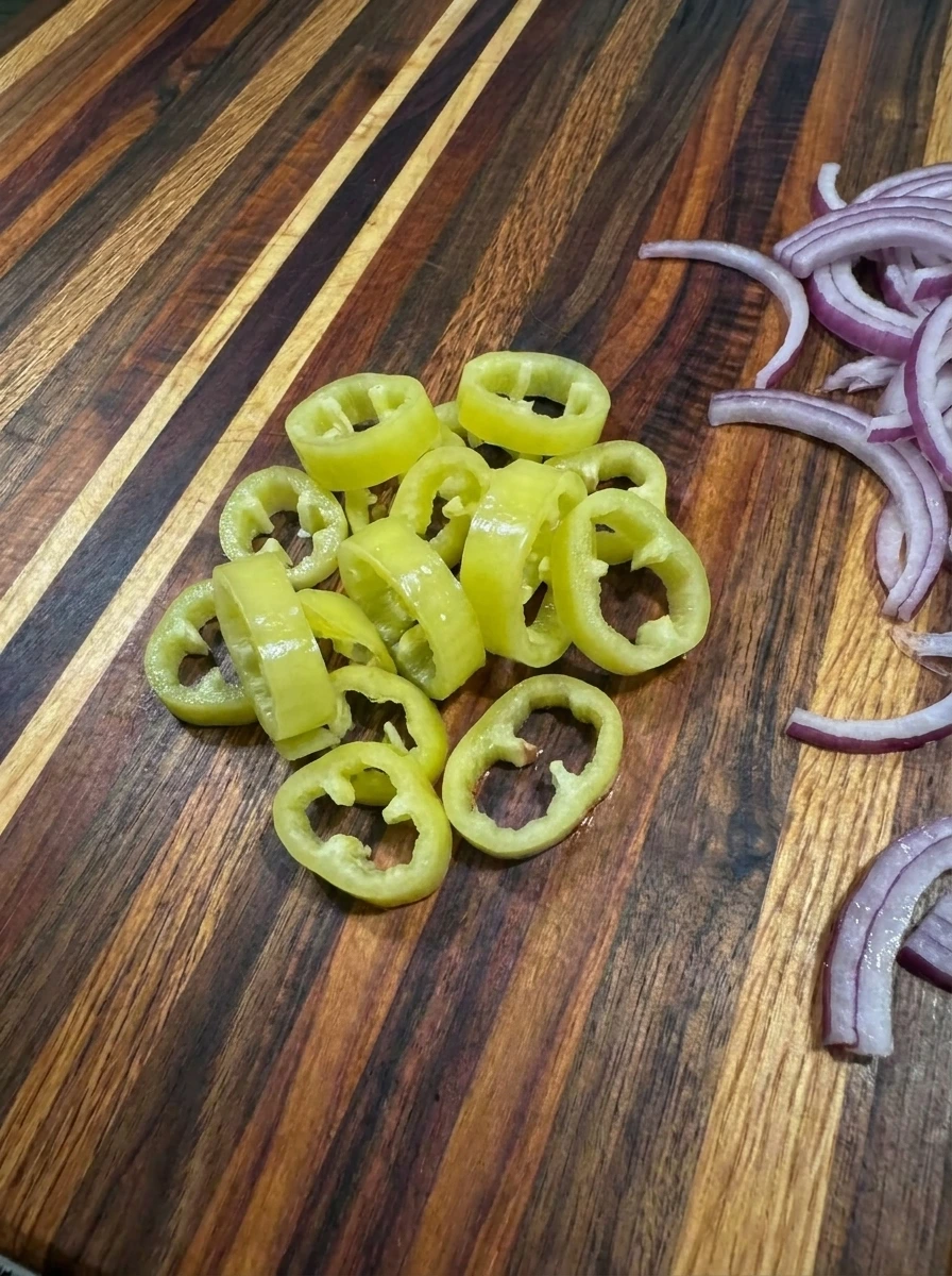 Sliced banana peppers and red onion for Loaded Banana Pepper Flatbread