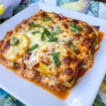 Patty Pan Squash Lasagna Bake with melted cheese and golden edges