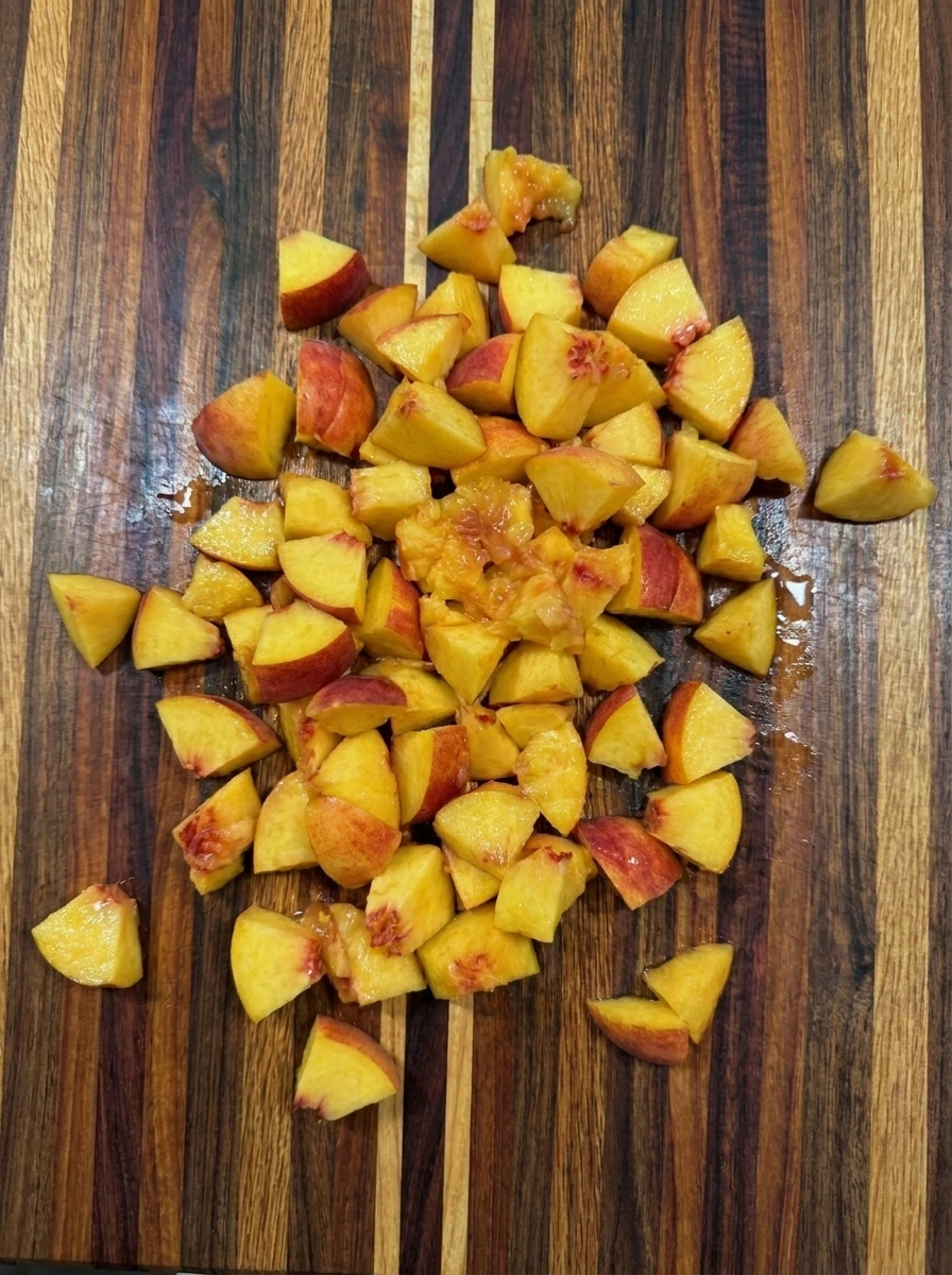 Diced peaches for Peach Overnight Oats on a cutting board