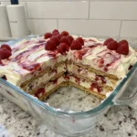 Raspberry Icebox Cake with creamy layers and fresh raspberries