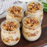 Creamy Apple Pie Overnight Oats topped with cinnamon apples and chopped pecans