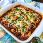Beef Enchilada Tortellini with melted cheese and red enchilada beef sauce