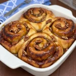 Caramel Pecan Cinnamon Rolls with glossy caramel and toasted pecans