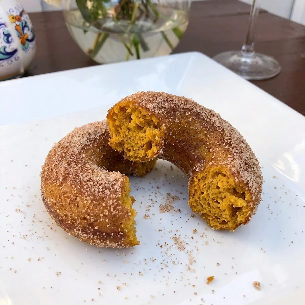 Single Cinnamon Sugar Pumpkin Donut served on a white plate