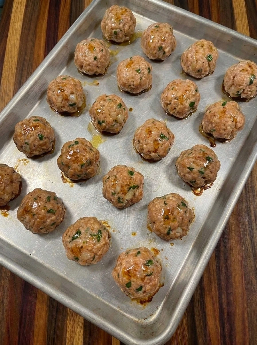 Baked Cranberry Meatballs with golden patches