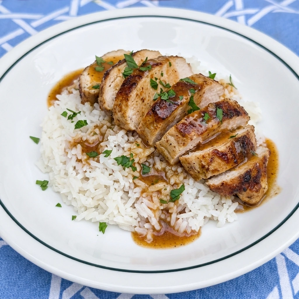 Single serving of Crockpot Cajun Butter Chicken over white rice
