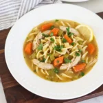 Homemade Crockpot Chicken Noodle Soup with shredded chicken and vegetables