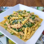 Creamy Crockpot Cowboy Butter Chicken Pasta with tender chicken spinach and Parmesan