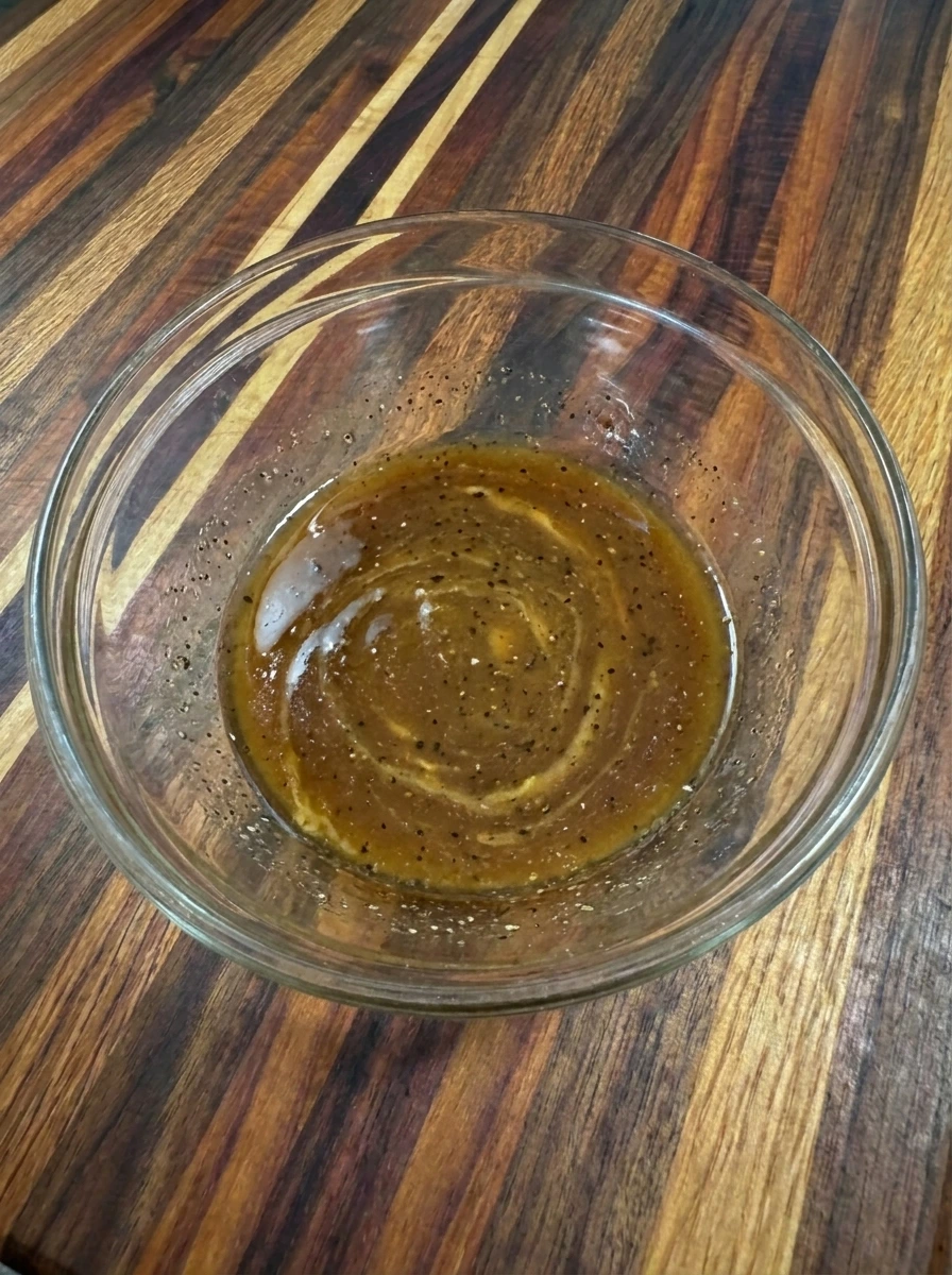 Glossy balsamic dressing mixed for Fig Goat Cheese Salad