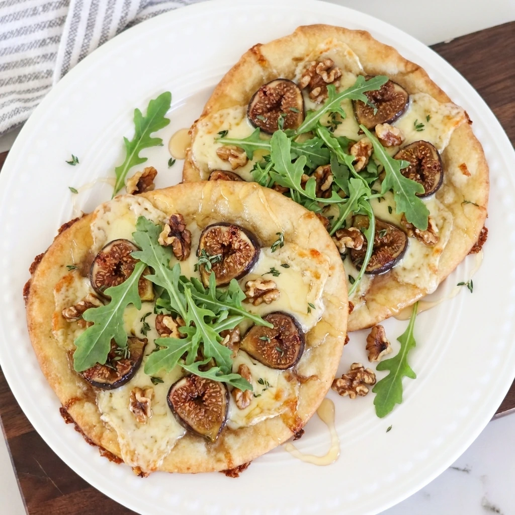 Fig Walnut Flatbread with goat cheese walnuts arugula and honey