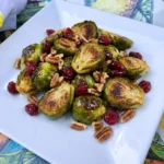 Maple Roasted Brussels Sprouts with toasted pecans and cranberries
