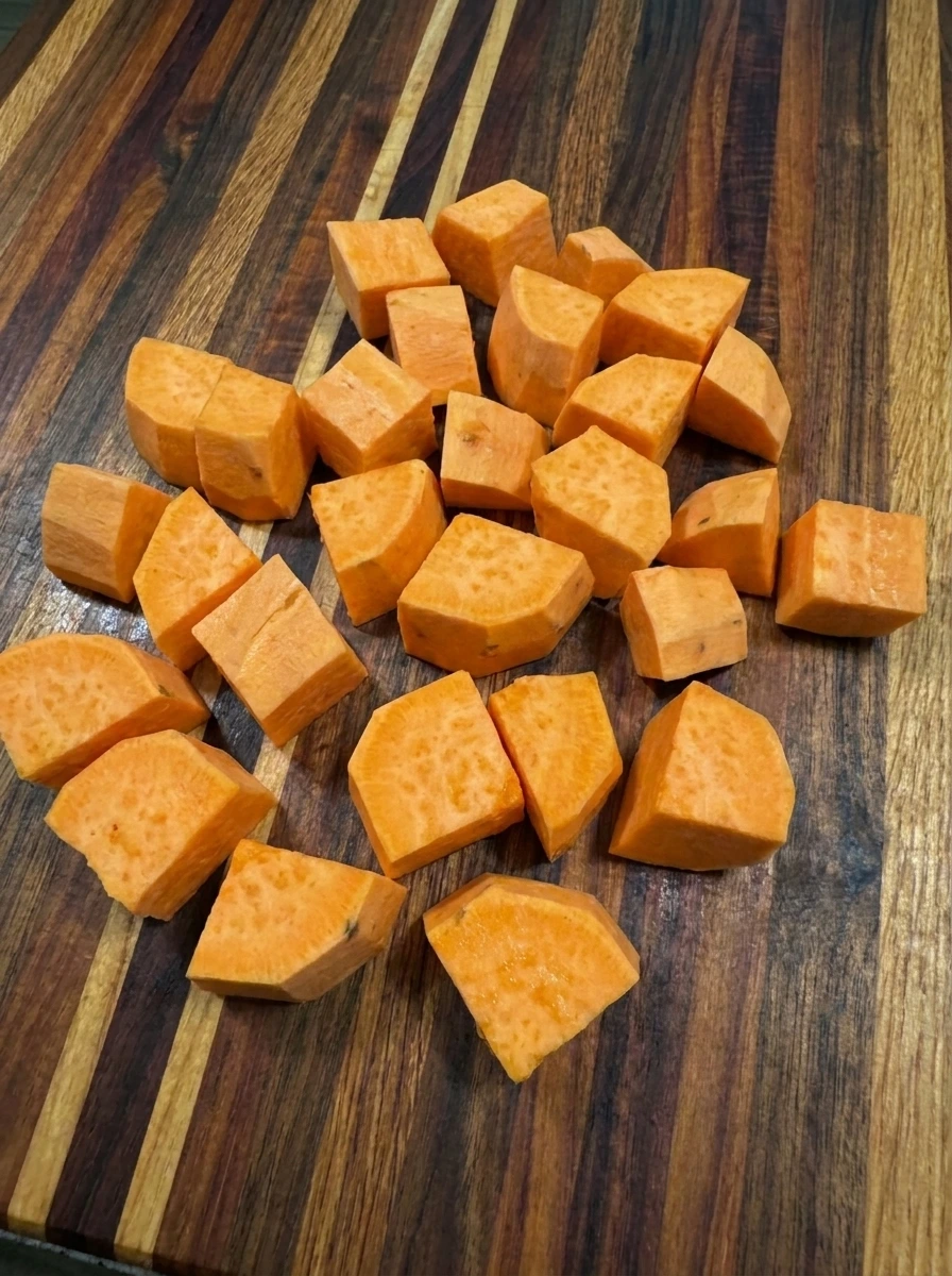 Peeled sweet potatoes cut into chunks for Maple Sweet Potato Mash