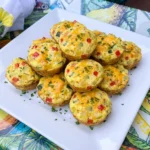 Patty Pan Squash Egg Muffins with golden cheese and colorful vegetables