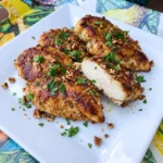 Pecan Crusted Chicken with golden pecan coating on a white plate