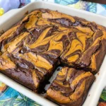 Fudgy Pumpkin Cheesecake Brownies with creamy pumpkin swirls