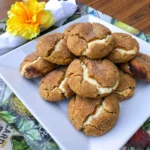 Pumpkin Cheesecake Cookies with creamy centers and soft pumpkin spice cookie edges