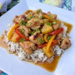 Sweet Hawaiian Crockpot Chicken with pineapple and peppers over rice