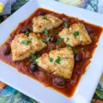 Tomato Braised Fish with tender white fish fillets in thick tomato olive sauce
