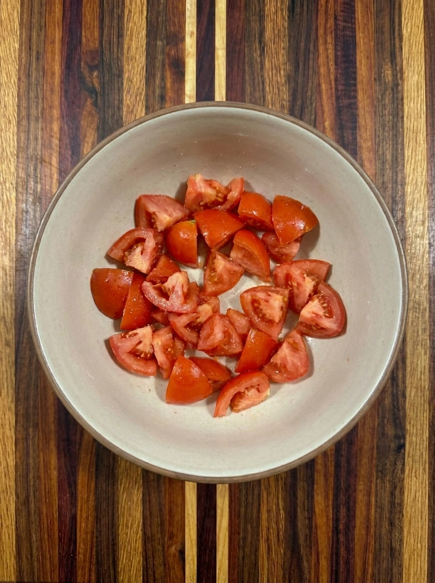 Four chopped and drained tomatoes ready for Tomato Fritters