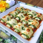 Baked Zucchini Roll-Ups filled with ricotta and topped with marinara and melted mozzarella