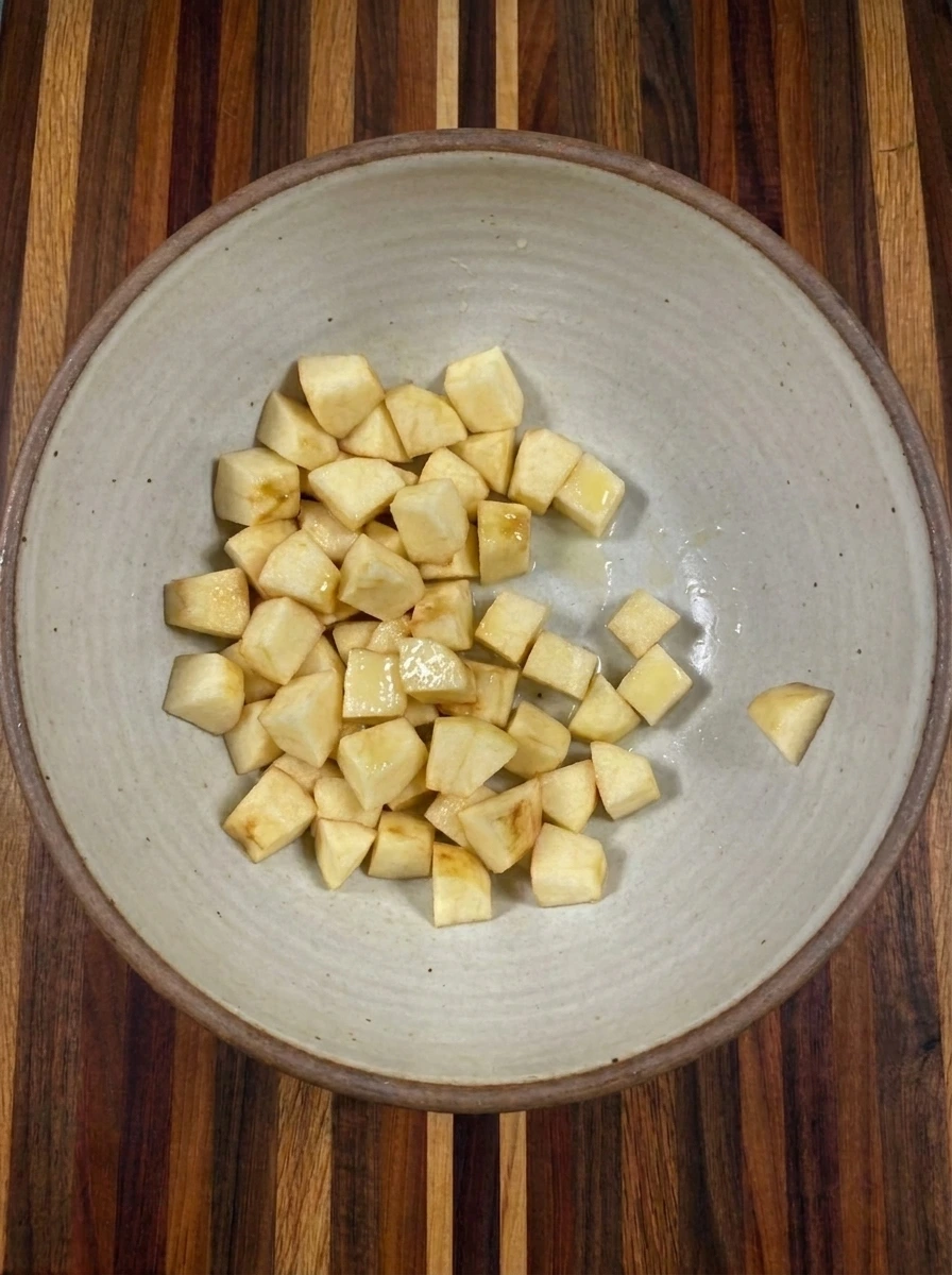 Four apples diced into small cubes for Apple Pie Dip with Cinnamon Sugar Chips