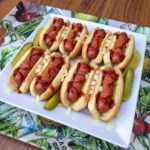 Bloody Finger Hot Dogs in toasted buns with ketchup and onions