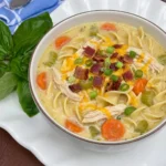 Creamy Crack Chicken Noodle Soup with shredded chicken plus bacon and cheddar