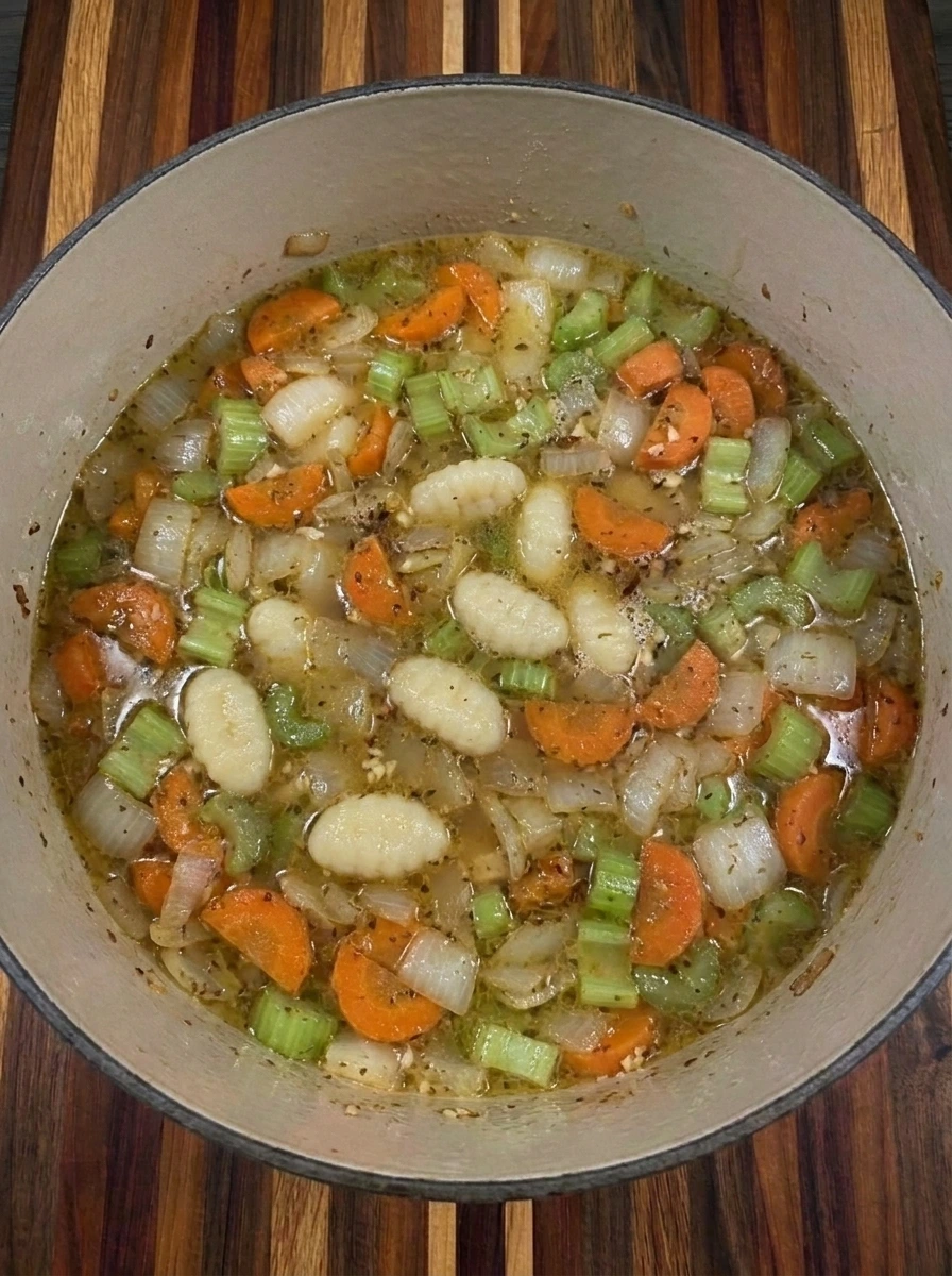 Gnocchi simmering in broth for Creamy Chicken Gnocchi Soup