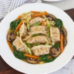Potsticker Soup with tender dumplings and vegetables in savory broth