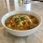 Egg Roll Soup with pork cabbage carrots and green onions