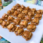 Caramel Apple Pretzel Bites with cinnamon apples and caramel on crisp pretzels