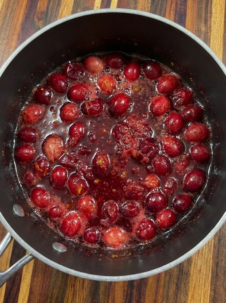Burst cranberries simmering for Homemade Cranberry Sauce