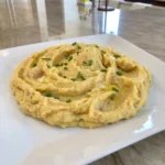 Creamy homemade Mashed Potatoes with butter and fresh chives