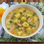 Creamy homemade Potato and Bean Soup with tender potatoes and white beans topped with parsley