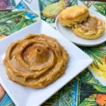 Creamy homemade Pumpkin Spice Honey Butter with golden honey and warm cinnamon swirls in a ceramic serving dish.