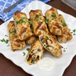 Crispy golden Southwest Egg Rolls filled with chicken and beans and corn and melted cheese